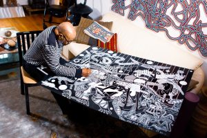 Artist Charles McGee at work in his studio