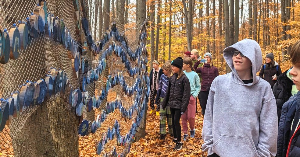 Students observing Michigan Blue at Michigan Legacy Art Park